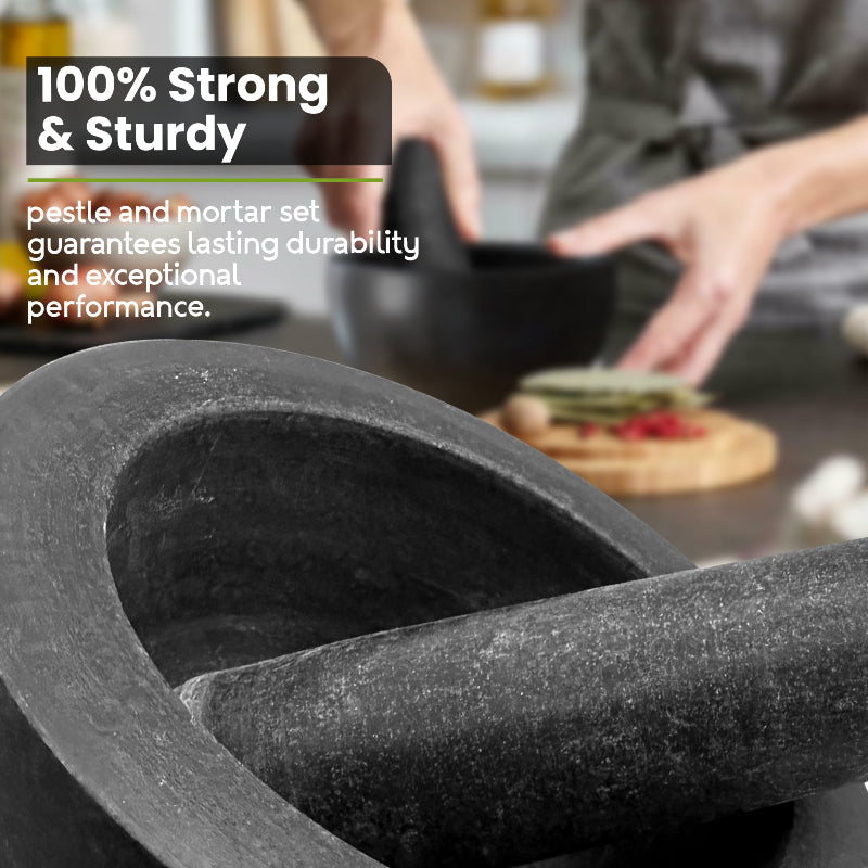 Close-up of a stone pestle and mortar with text about durability, used in a kitchen setting.
