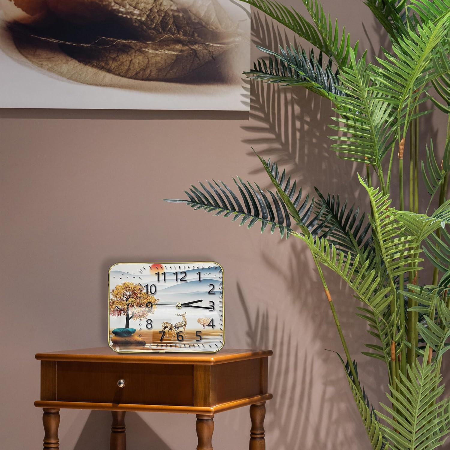 Decorative clock on a wooden table with a plant in the foreground
