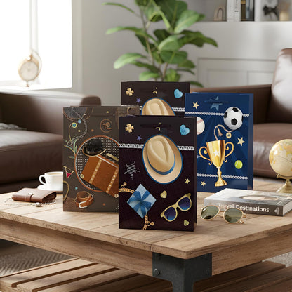 Four decorative boxes with various designs on a wooden table in a living room setting.