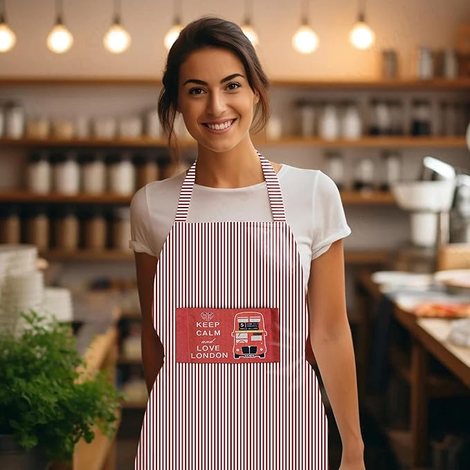 Woman wearing a striped apron with a London-themed design in a kitchen setting.