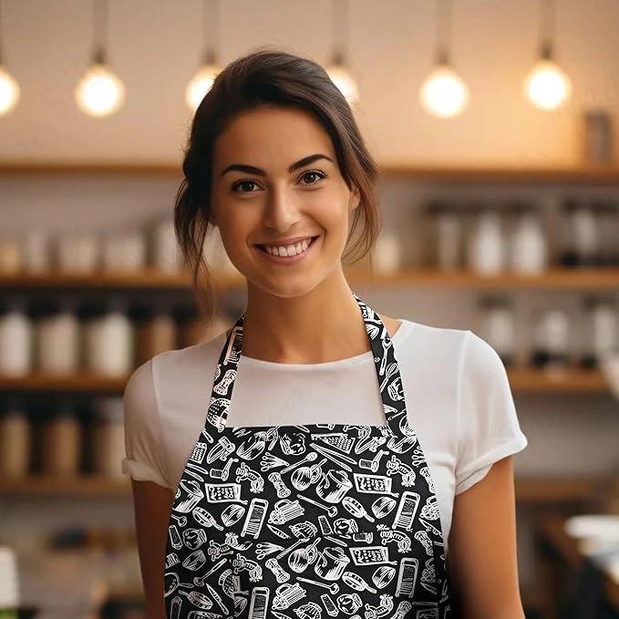 Woman wearing a black apron with white patterns in a kitchen setting