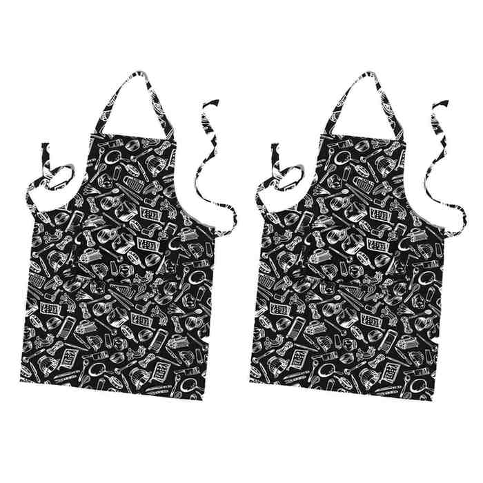 Two black aprons with white patterns on a white background