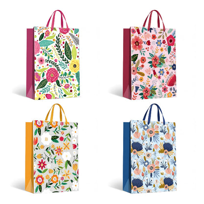 Four floral-patterned shopping bags with different color handles on a white background
