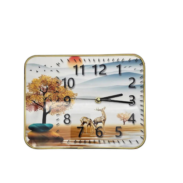 A colorful wall clock featuring the London Big Ben and the Buckingham Palace, displayed on a wall above a plant and a framed picture.