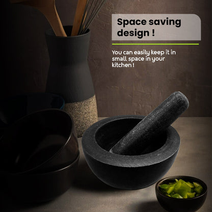 Black kitchen utensils including bowls, a mortar and pestle, and a whisk container on a dark surface with text about space saving design.